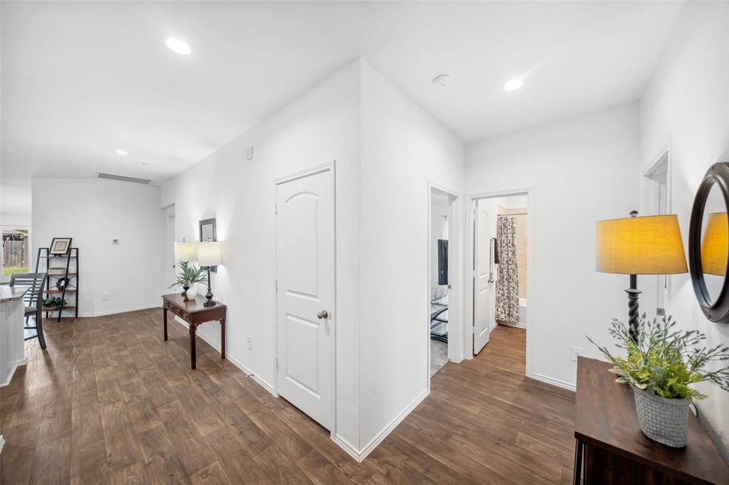 Foyer splits off to 2 secondary bedrooms with secondary bathroom between.
