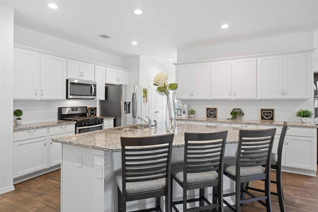 Fantastic kitchen features massive island with seating for up to 6 counter height chairs!