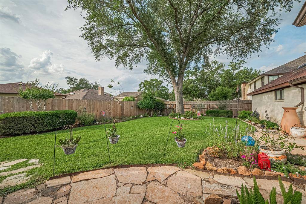 Beautiful landscaped fenced backyard.