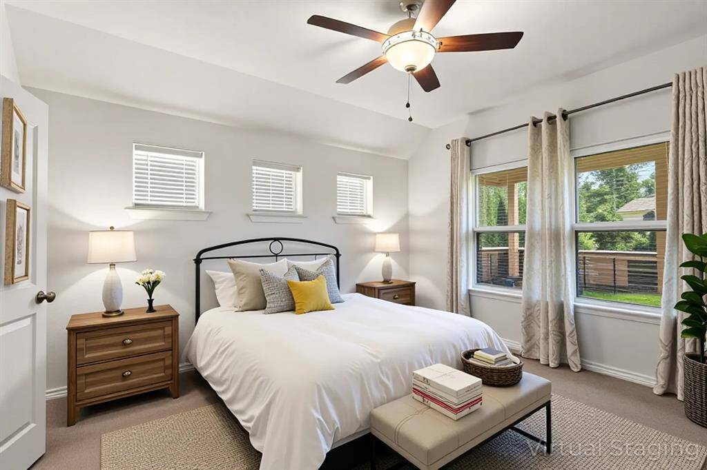 *Staged photo* A cozy and well-lit additional bedroom, providing a comfortable space for family or guests.