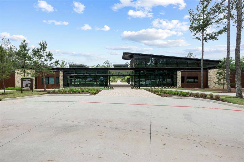 Immerse Yourself in a Blissful Yoga Practice on the Green Space, Embracing the Serene Atmosphere of the Community Center's Outdoor Haven.
