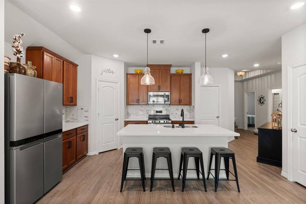 Open-concept living, dining, and kitchen area, designed for modern comfort and entertaining.