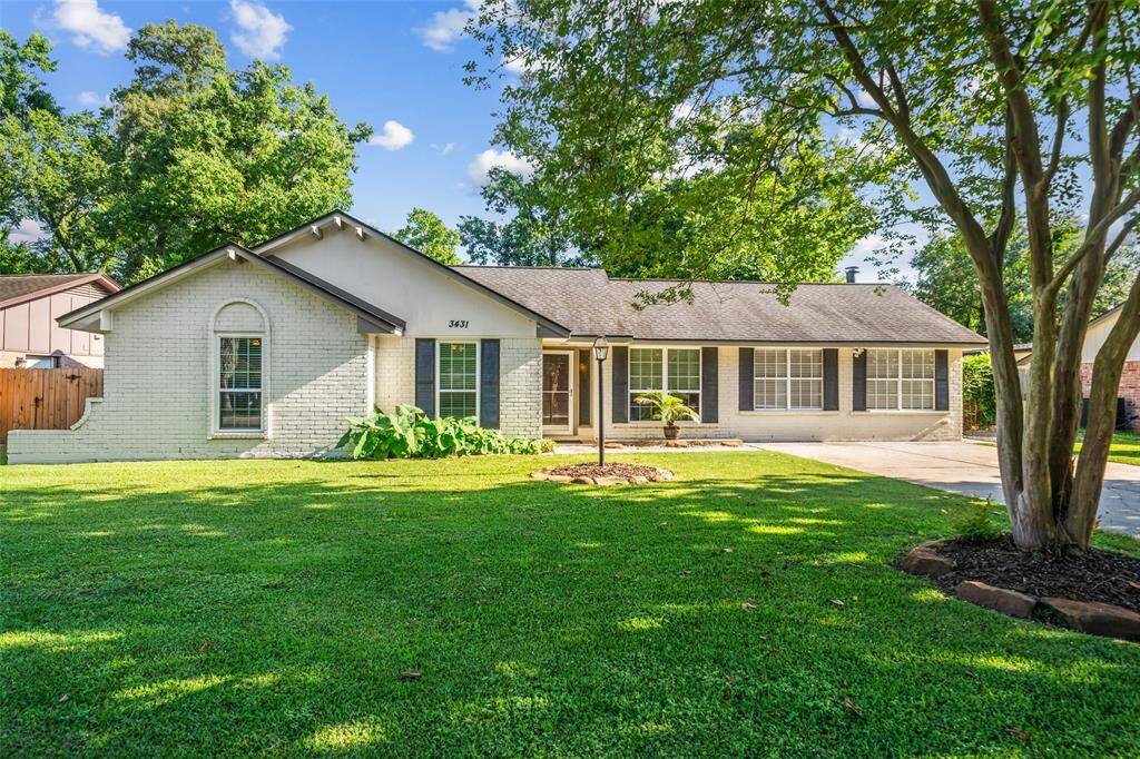 Beautiful brick home with new windows along the front.