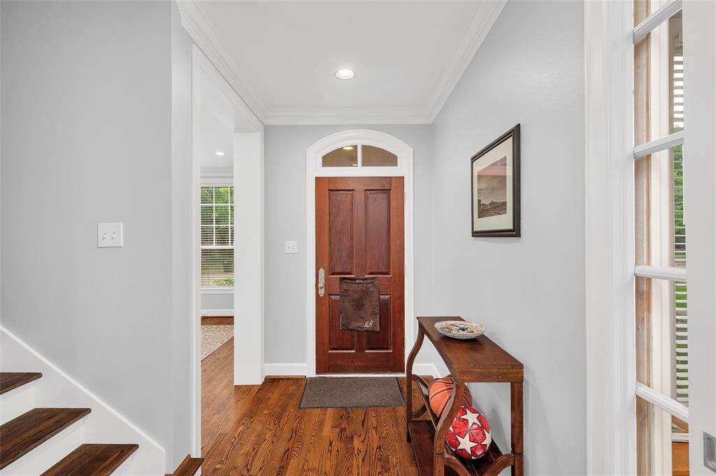 Formal entry flanked by formal dining and study