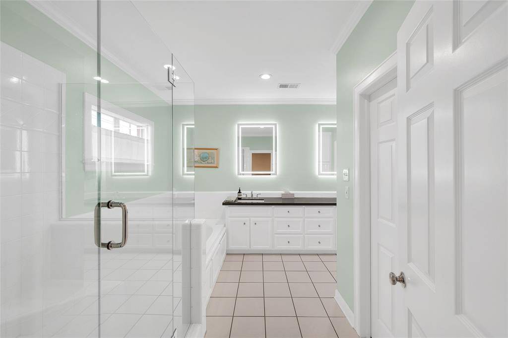 Master bath updated with quartz counters, double sinks, lighted mirrors