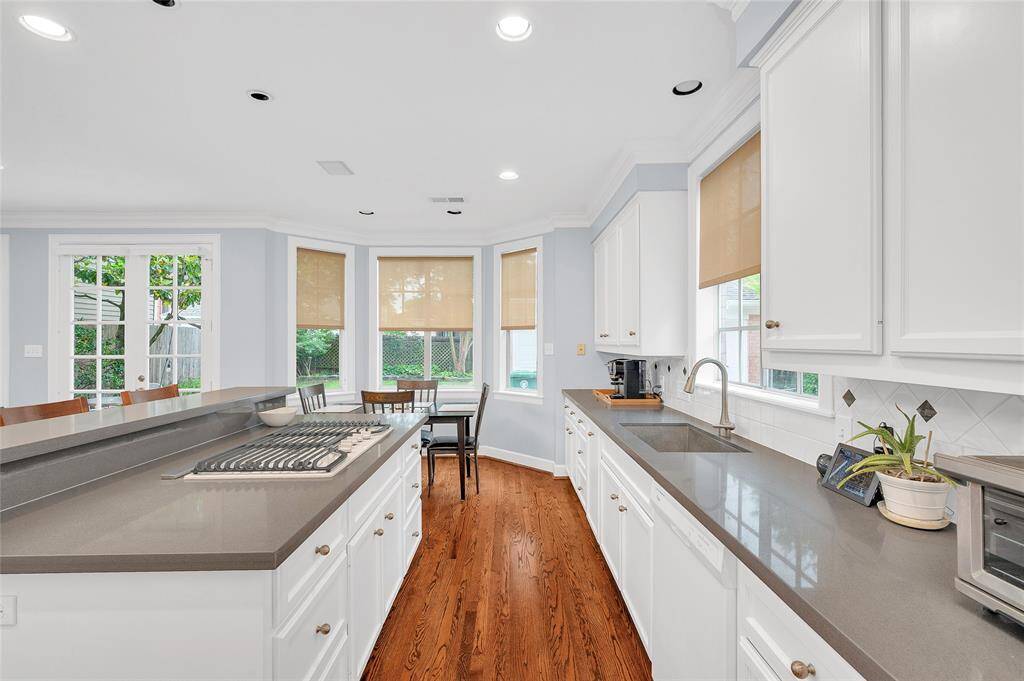 Recent new quartz countertops with neutral whte backsplash