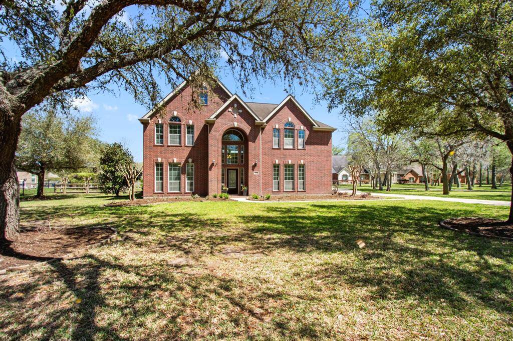 Experience resort-style living in this stunning 4-Bedroom home, nestled inside the prestigious golf gated community of Weston Lakes. Resting beneath a canopy of majestic oak trees, this home sits on a generous 1.09-Acre lot.