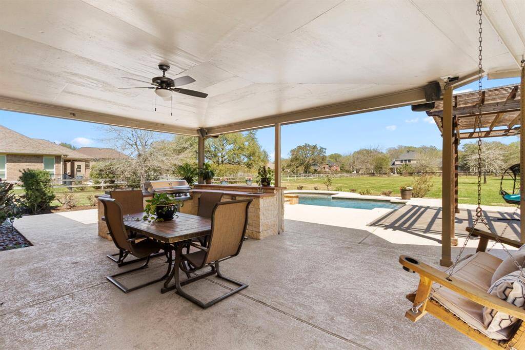 Let’s step outside to this 1.09-acre backyard oasis, featuring a huge, covered Patio—perfect for entertaining. The space is enhanced by cool decking surrounding the sparkling chlorine pool and spa, along with a ceiling fan to keep you comfortable while you relax.