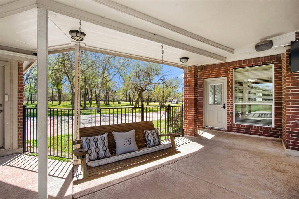 The Backyard is fully fenced, and the breezeway has a wrought iron fence/gate separates the driveway from the backyard space, providing access to the oversized 2-car garage.