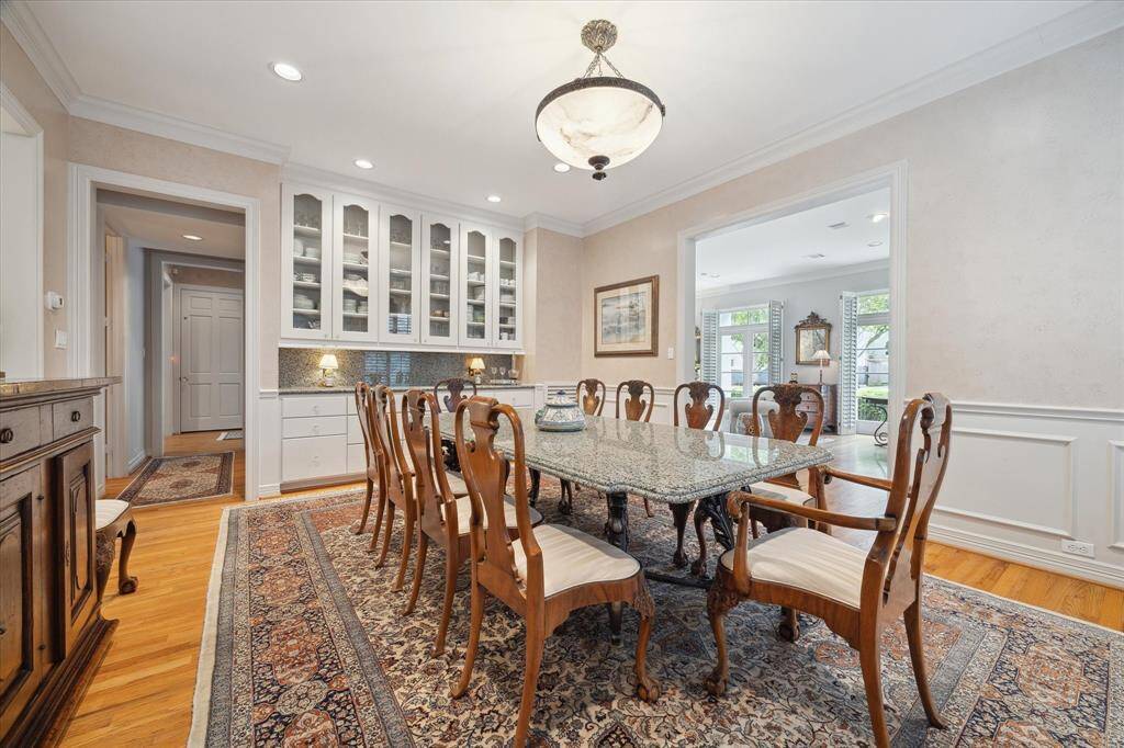 Elegant dining room. Plenty big to host family gatherings of any size. There is a powder room in the hallway for easy guest access.