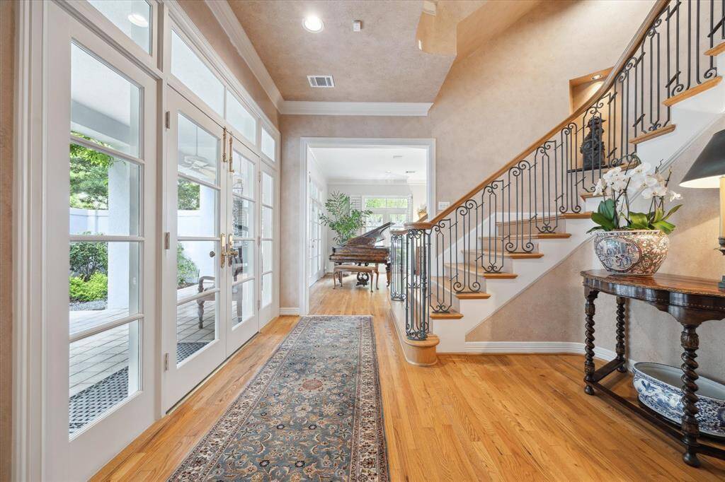 Another view from the double door entry looking towards the gracious, light filled formal living room.