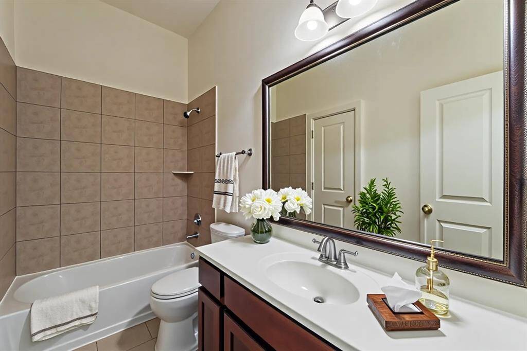 Virtually staged secondary bathroom.