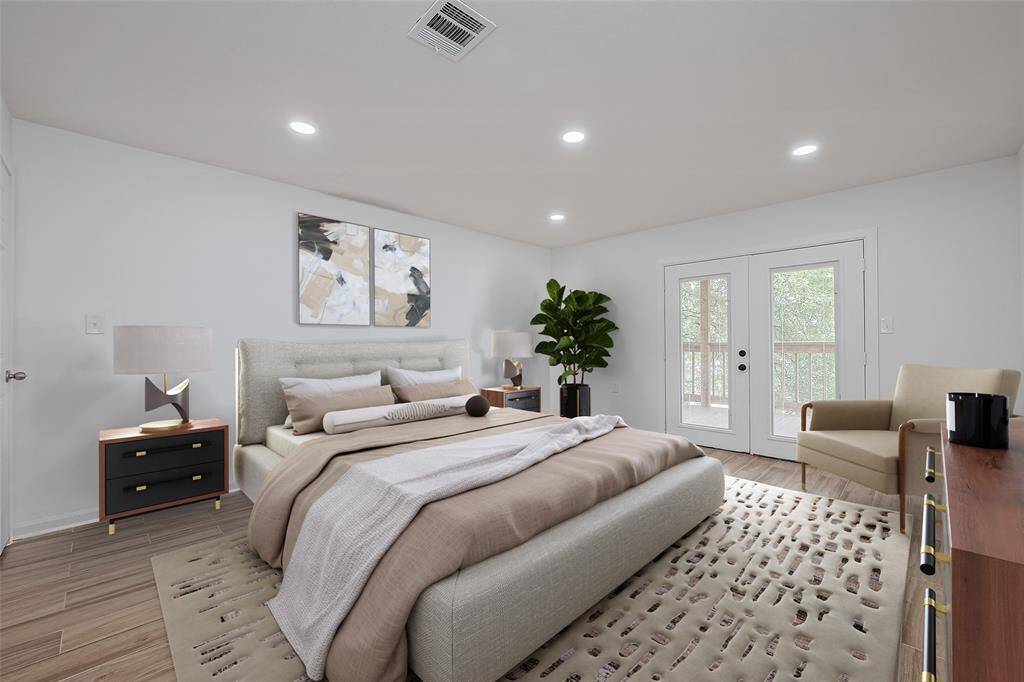This bright, spacious bedroom features recessed lighting, wood-look tile flooring, and French doors that open to a private balcony. Virtually staged with modern furniture for a warm, inviting feel.