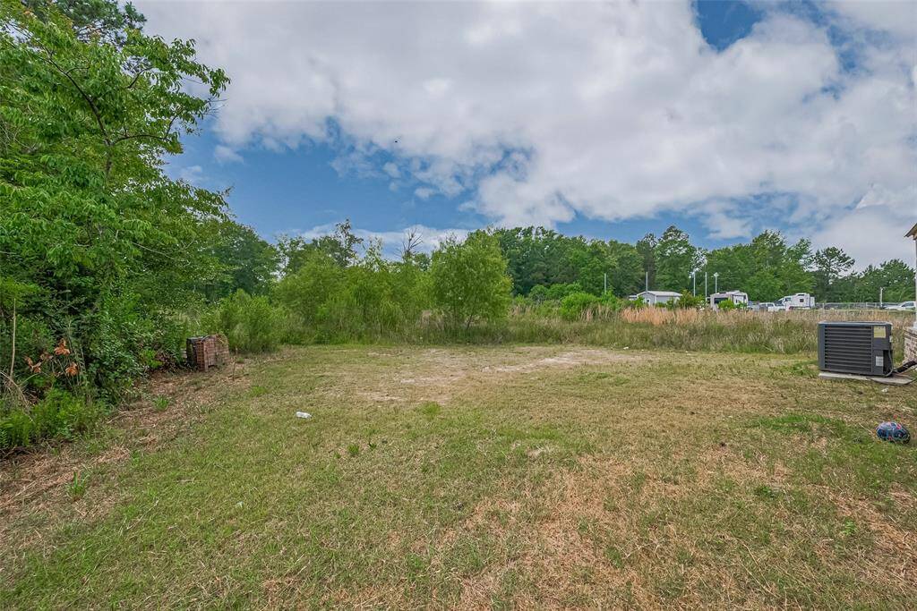 ChatGPT said:Expansive backyard with endless potential—partially cleared and bordered by natural vegetation, offering space for future projects, outdoor entertaining, or enjoying peaceful country views.