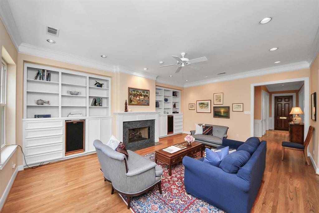 The generous living area flows seamlessly into the kitchen, creating an open and connected space for everyday living and entertaining.