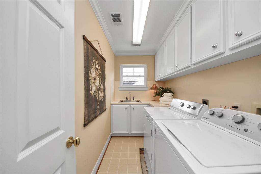 A well-placed second-floor laundry room provides seamless access from each bedroom, combining function with thoughtful design.
