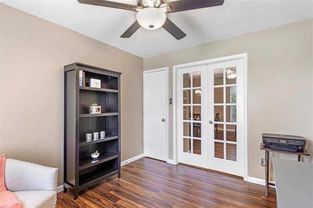 The study features elegant French doors, laminate wood flooring and neutral walls. The room offers versatility for use as an office or can easily be converted to a 4th bedroom.