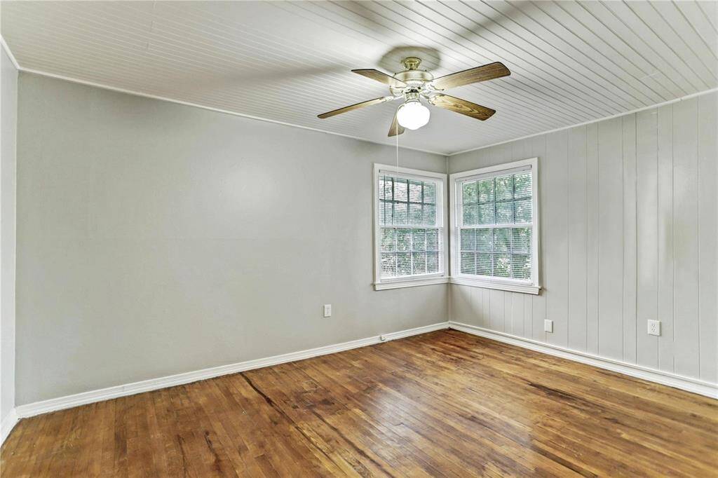 Each Bedroom boasts real Hardwood Floors, abundant closet space, window treatments, ceiling fan and light & more!