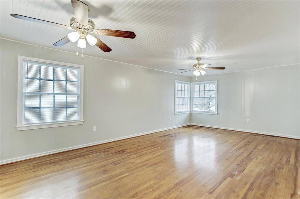 Massive Living Space - boats original Maple  hardwoods, sparkling windows and blinds, ceiling fans and light kits, storage closet and more! Ideal for multiple uses, such as Living Rm and Study and Dining Room - Great layout and flow!