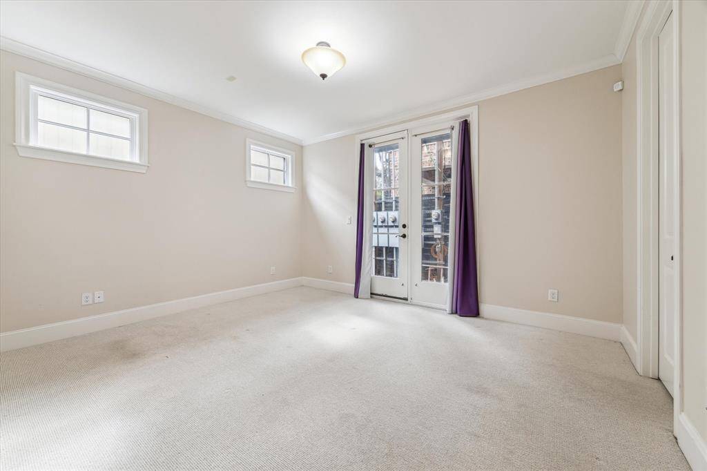One of two secondary bedrooms on the first floor with access to the patio.