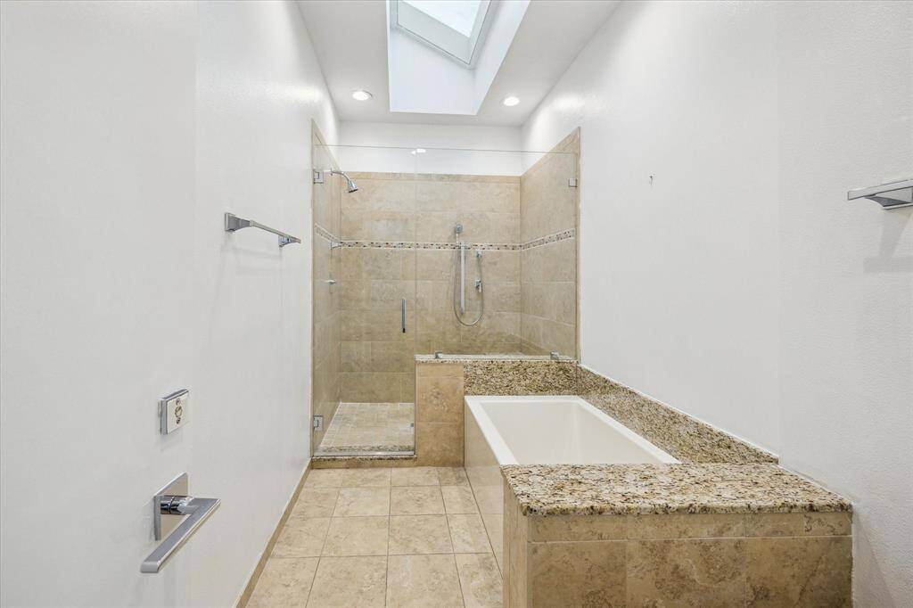 Primary Bathroom Features Huge Tub and Separate Shower.