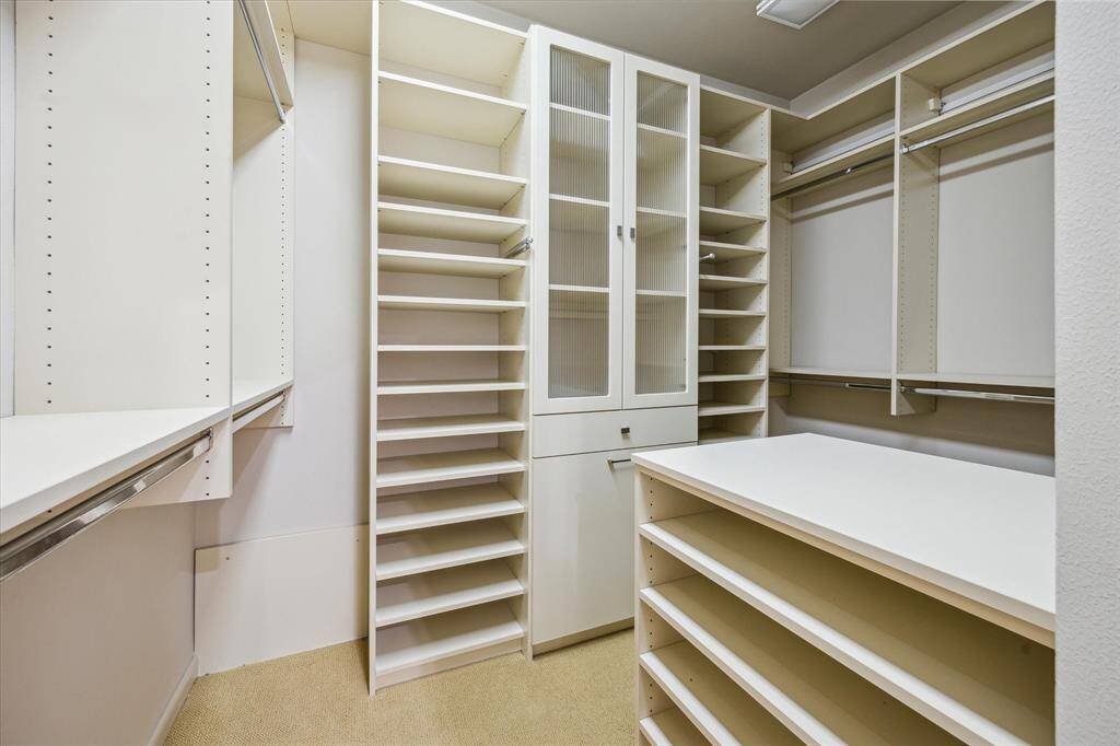 Experience Functionality In This Two Door Primary Closet. Walk In - Through - And Out.