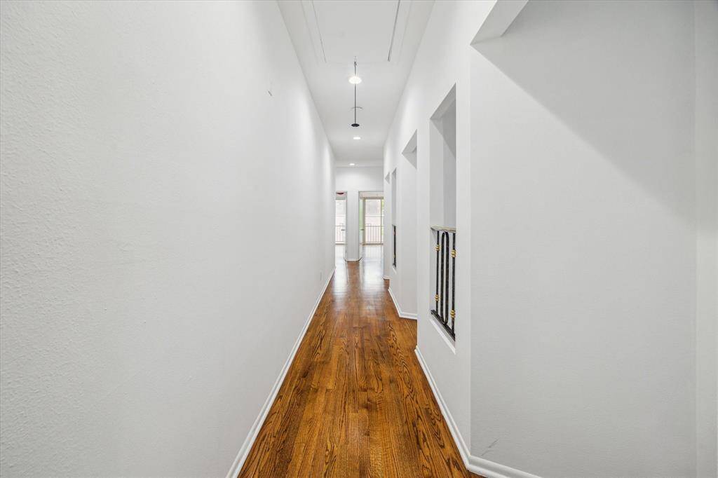 Upstairs Hallway Leads To Two Secondary Bedrooms With Art Niches Installed In Hallway