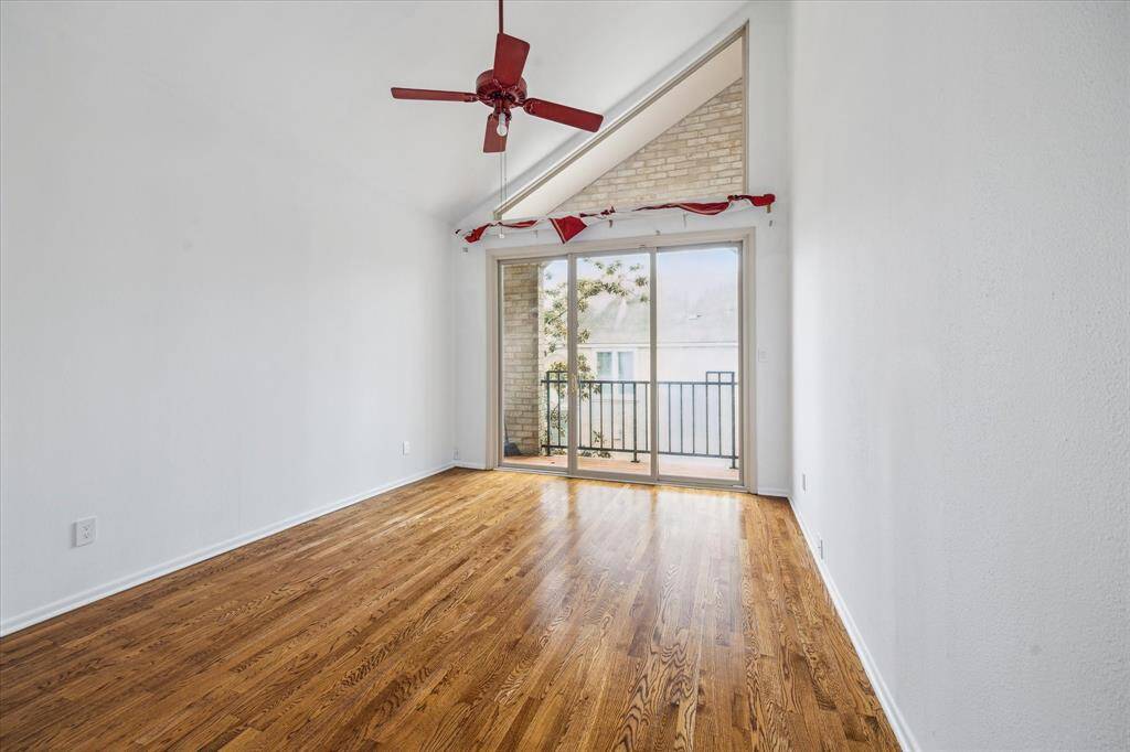 Sloped Ceilings In First Secondary Bedroom With Patio Overlooking Front Of 4 River Hollow.