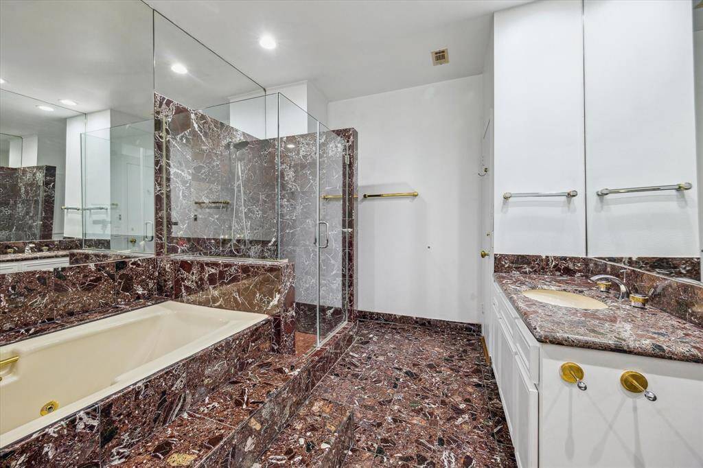Gorgeous Marble Bathroom With Jacuzzi Jetted Tub and Separate Shower.