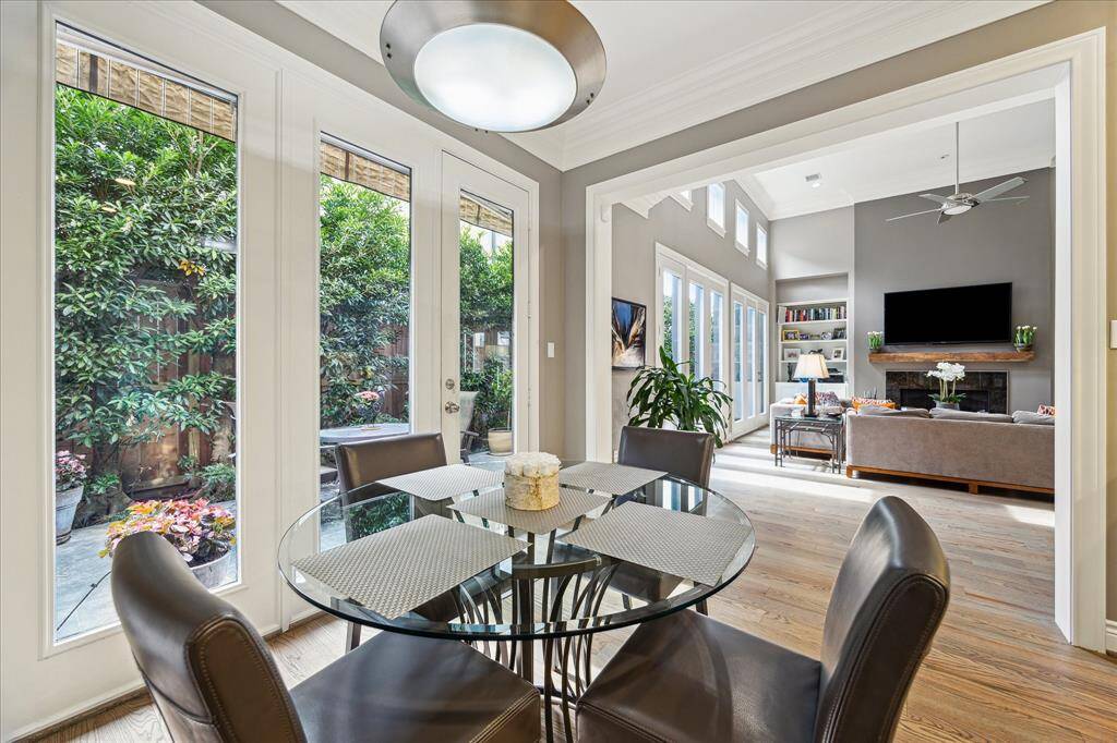 breakfast area back toward living area with opening to beautifully landscaped patio