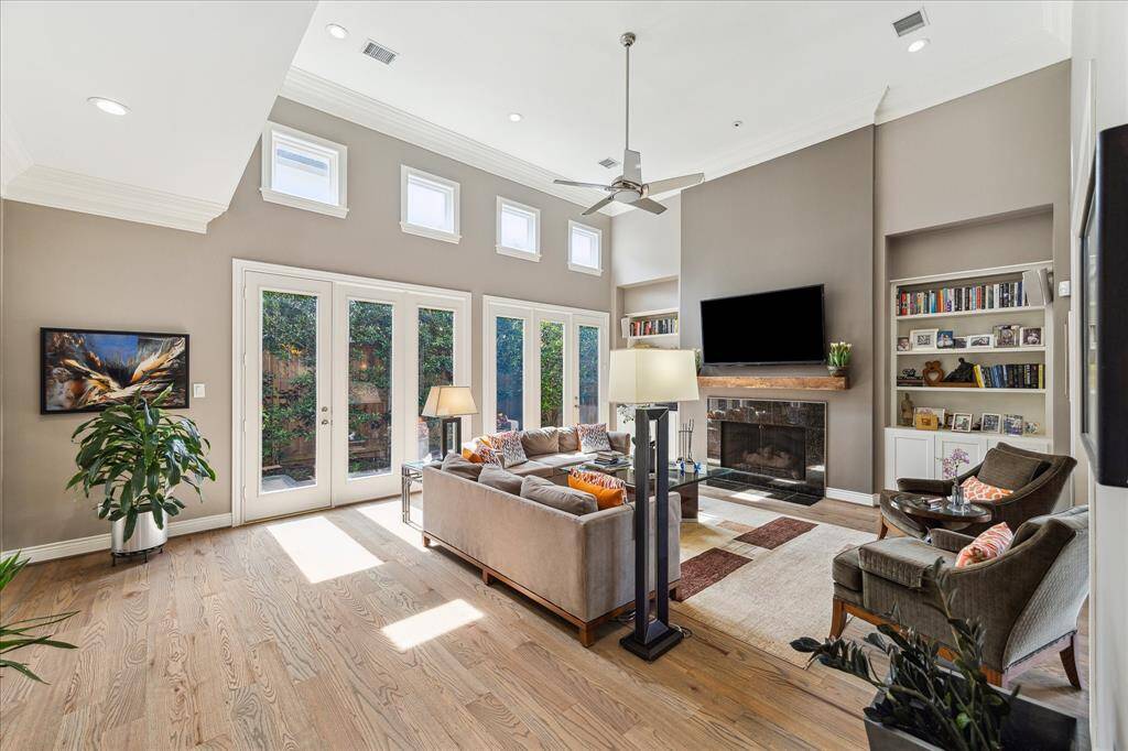 living area with fireplace and wall of windows