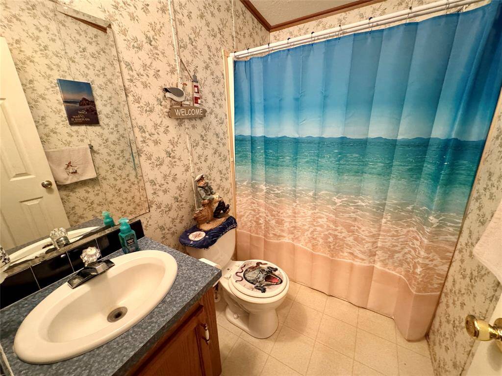 SPLIT floor plan offers main bedroom on one end with the living room separating the guest area.
