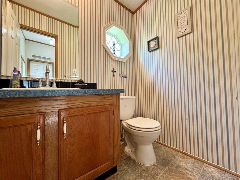 Door in Utility room to the left is to this half bath.