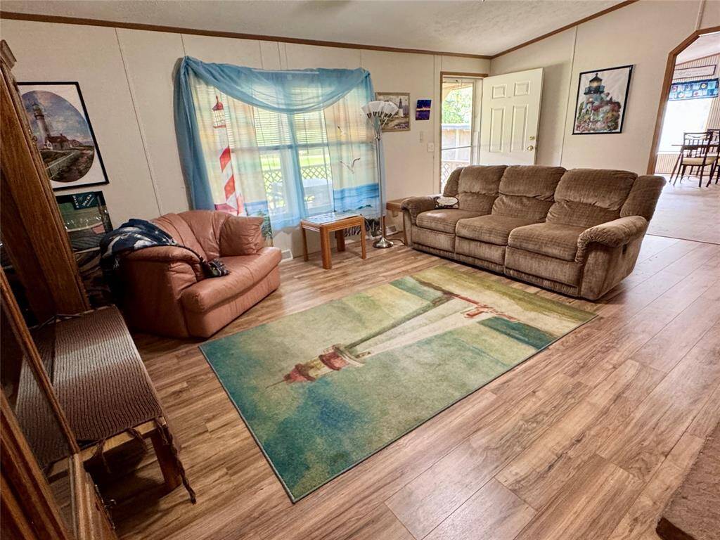 HIGH ceilings and a ceiling fan in the living room.