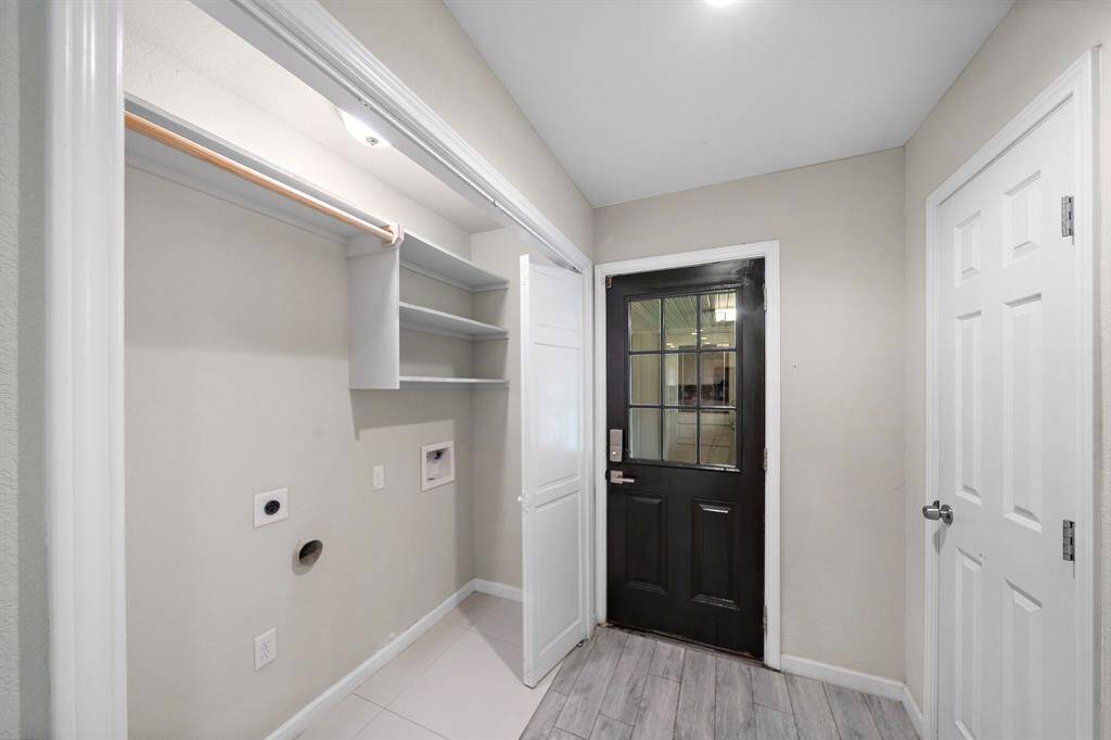 Laundry area leading to the detached garage.