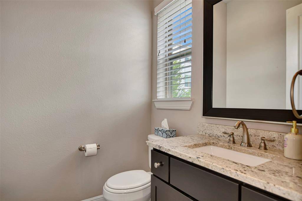 Powder room on the second floor is at the stair landing