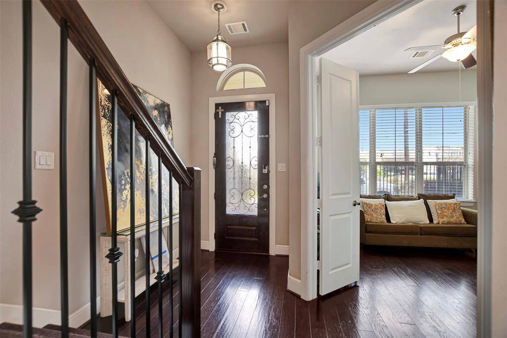 Delicate warm engineered floors as you walk in to the house.