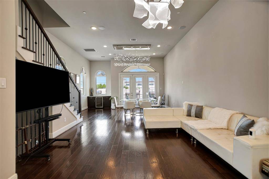 Enormous living/dining room space with french doors leading out to the 2nd floor patio