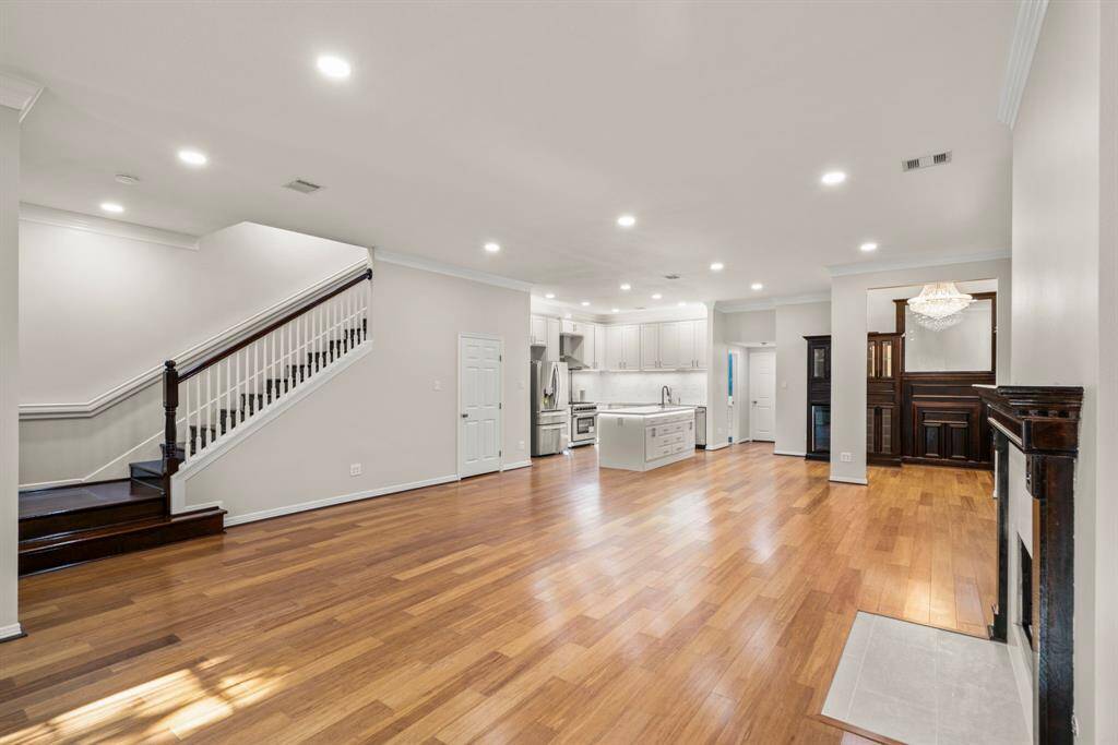 Amazing home  built in 2001 , features 5 bedrooms and 4 full bathrooms with open floor plan , hardwood floors, a modern kitchen with gas cooktop and  kitchen island, recessed lighting, and a cozy fireplace.The beautiful staircase leads to the upper level, and there's a charming chandelier in the dining area.