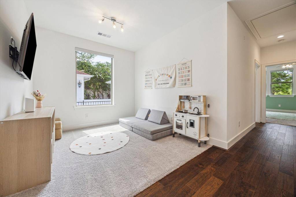 Located at the top of the stairs between the Primary Bedroom & the Secondary Bedrooms is this bonus Flex Space, perfect as a home office or a playroom.