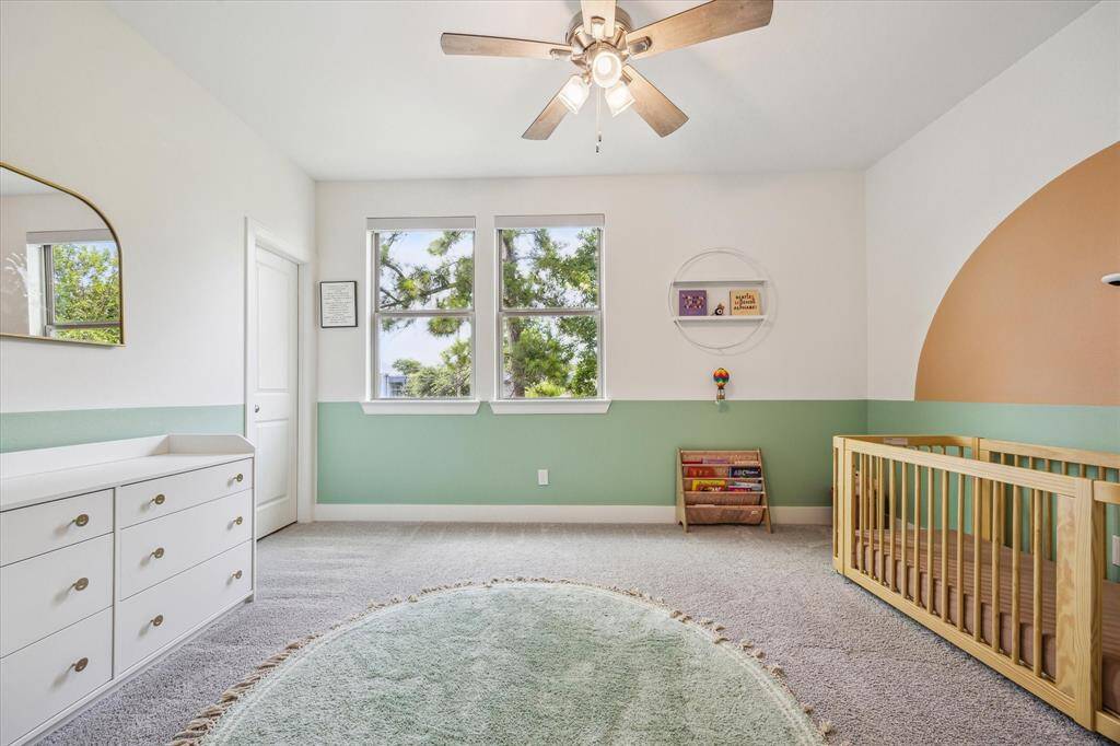 Secondary Bedroom #1 features two windows, carpet & a walk in closet.