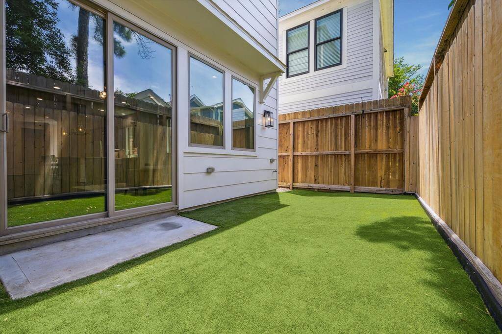 Off the Living Room's sliding glass door you are welcomed by a maintenance free, turfed backyard.