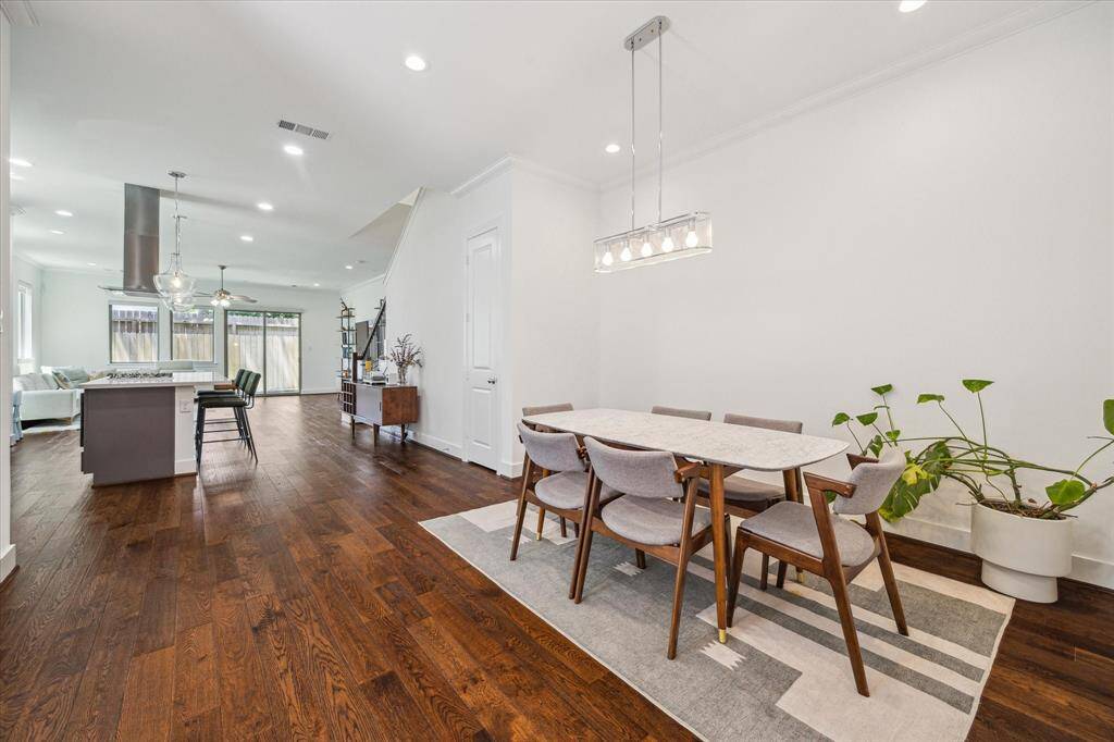 Entertain and host your guests in the spacious Dining Area. The door in the center of the picture is a large storage closet underneath the stairs.