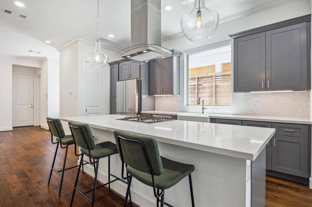 Alternate view of the Kitchen. The pocket door next to the Fridge leads to the spacious walk-in pantry.