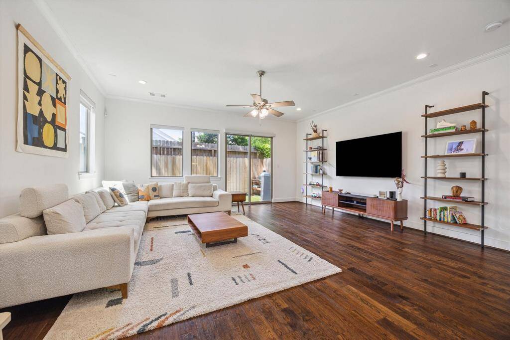 The spacious Living Area can accommodate many different furniture configurations. Motorized shades have been installed throughout the home.