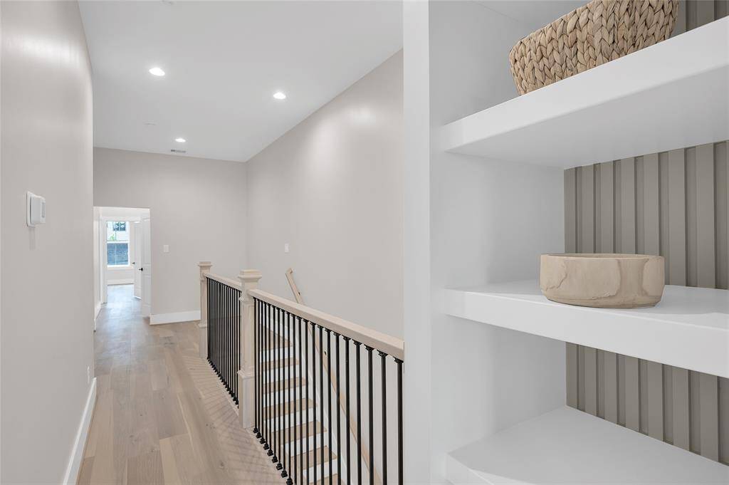 Built in bookcase near the door for primary bedroom
