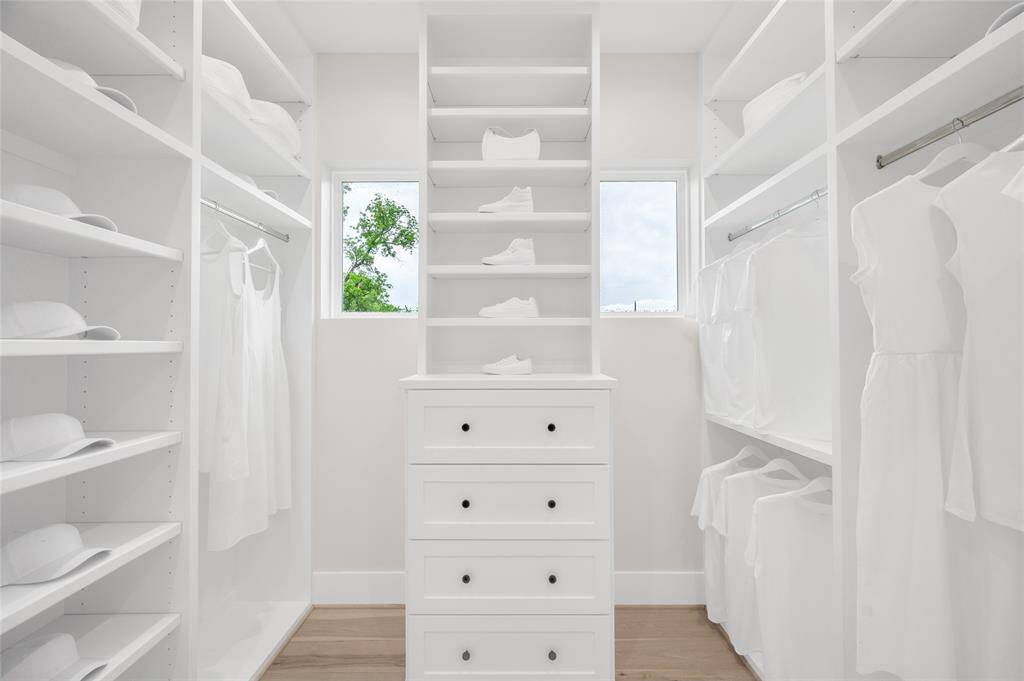 Built in drawers, adjustable shelving, and two windows
