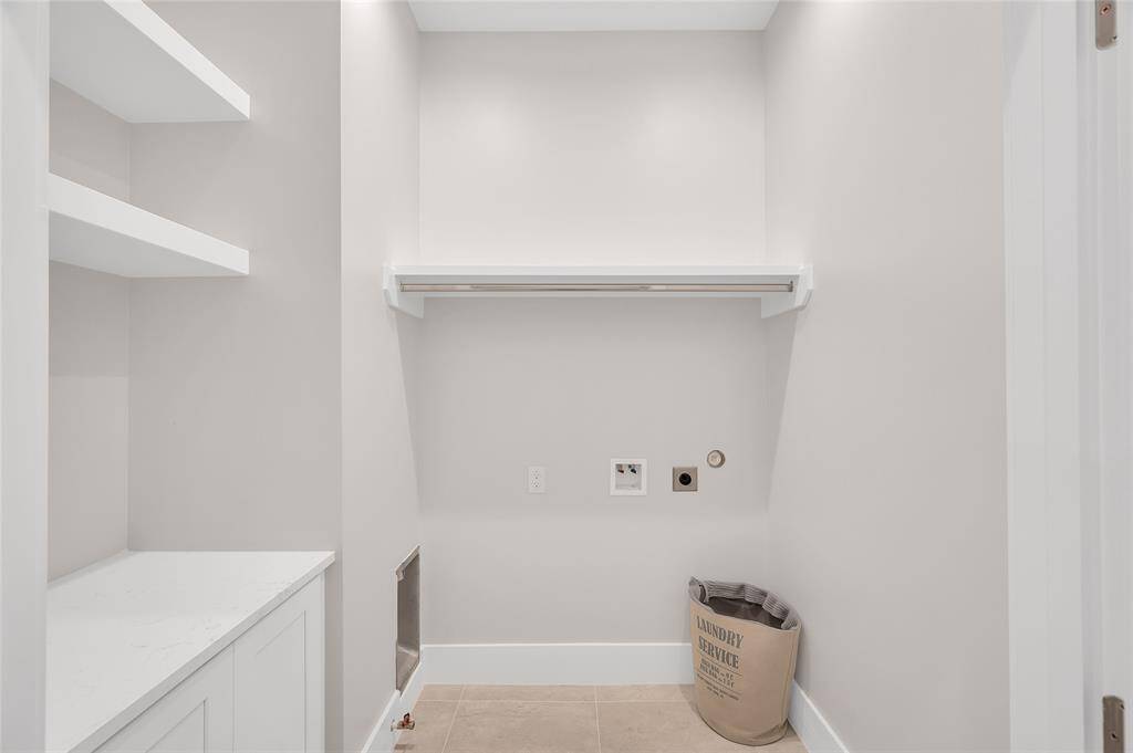 Laundry room with built in cabinet and quartz top