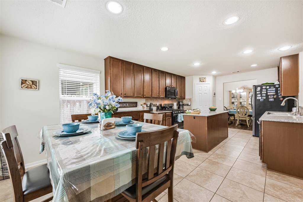 Enjoy quick eats with your loved ones in the breakfast nook with access to the backyard patio.