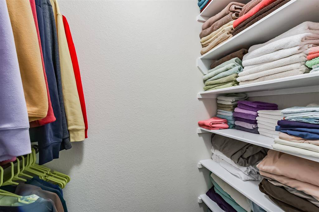 Additional shelving was added to this bedroom closet for optimal use of the space.